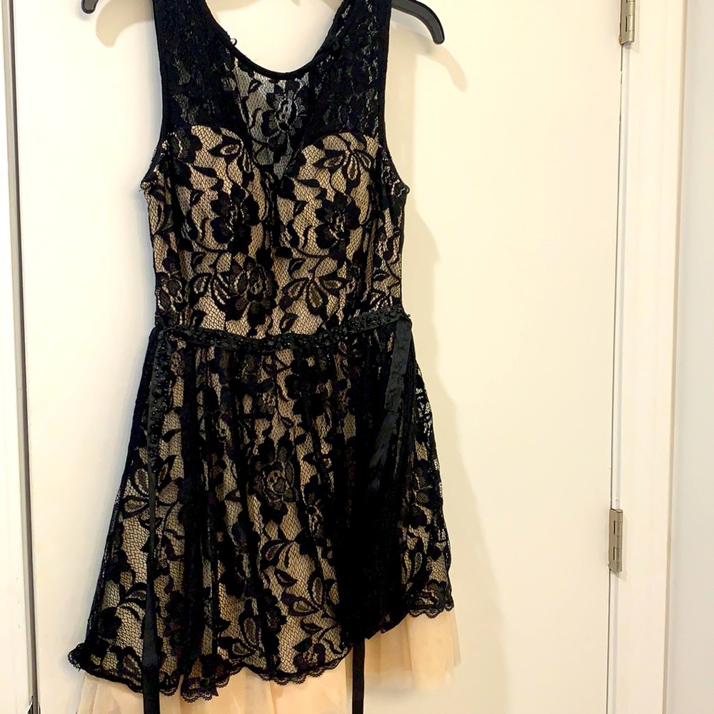 Black lace over tan dress